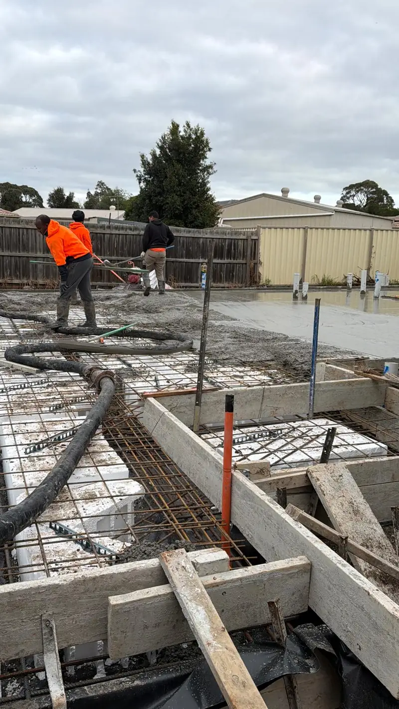 Concrete pump line laid across the slab reinforcement on pour day