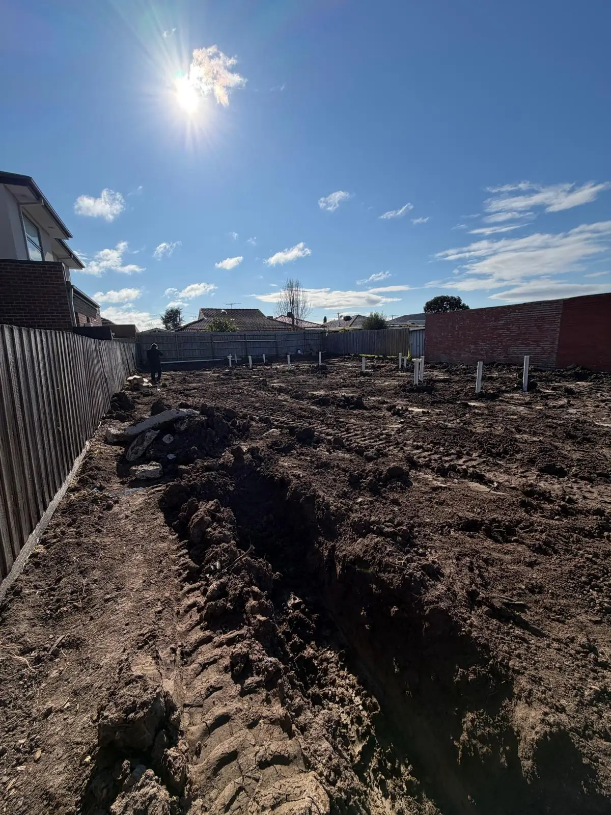 Drainage trench dug along the side of the block