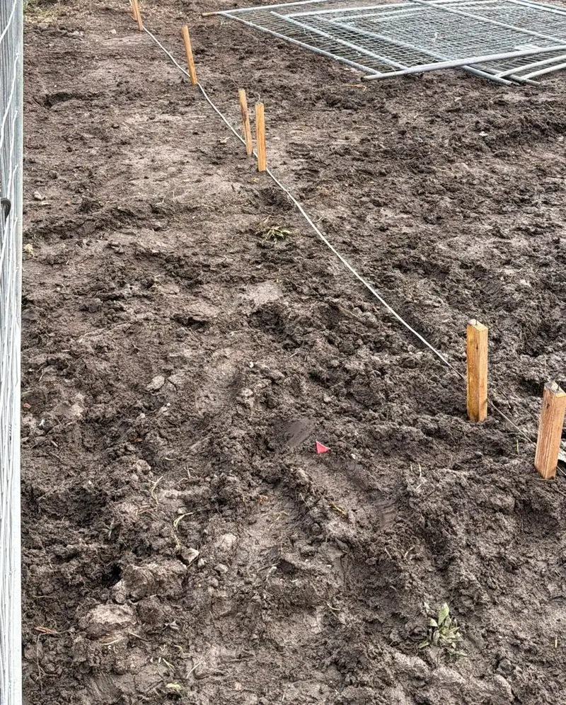 Set-out pegs and string lines on a Unitex townhouse site