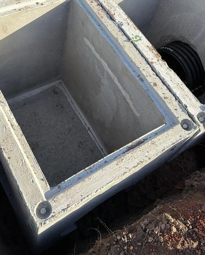 New concrete stormwater pit set into the ground